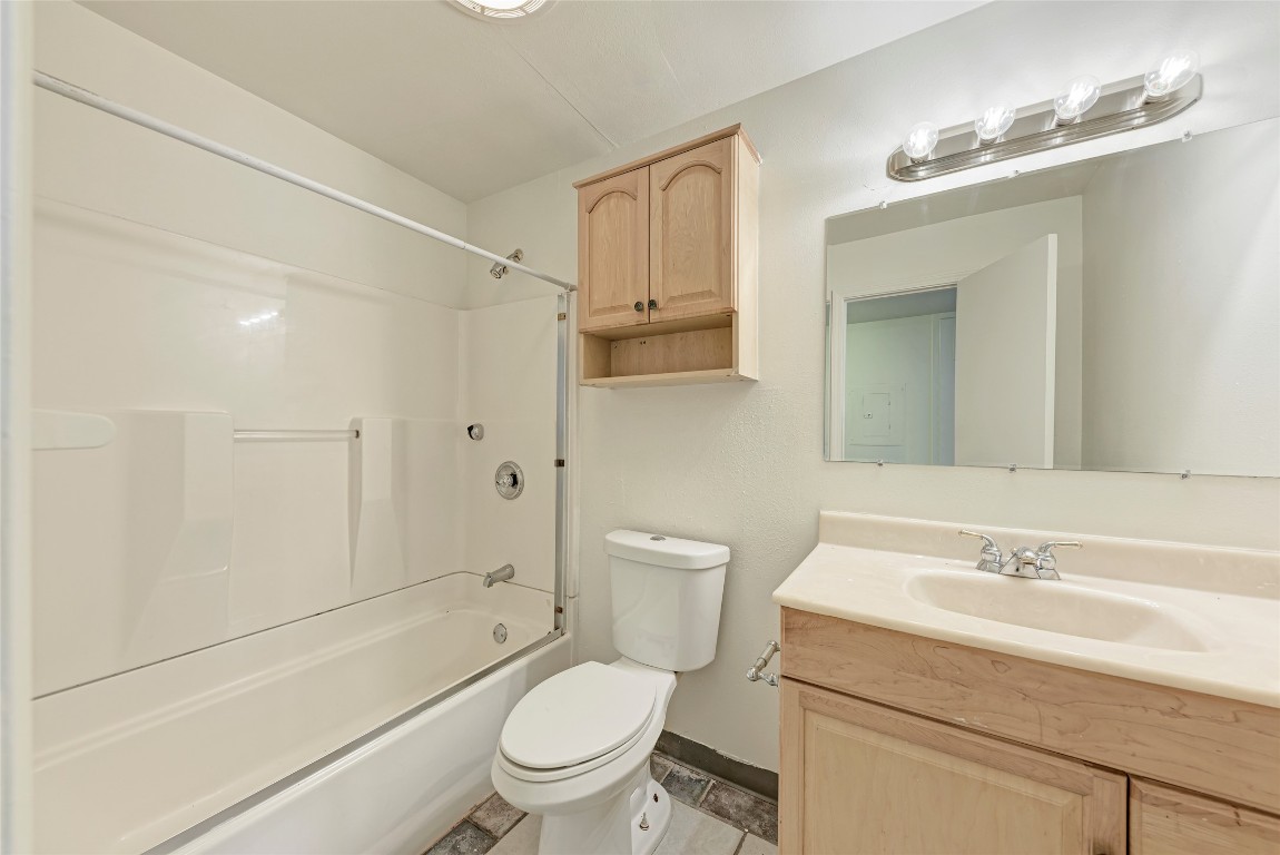 2404 Longview Street, Unit 101 Austin, TX 78705 - Photo 4 of 5 a bathroom with a sink toilet vanity and shower