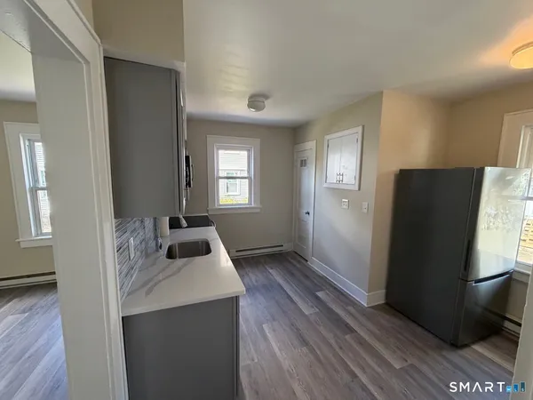 a room with windows and wardrobe