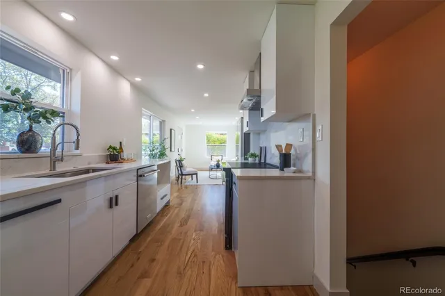 a large kitchen with lots of counter space and stainless steel appliances