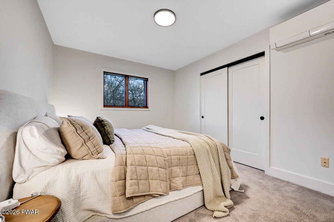 258 Lakeview Road Lackawaxen, PA 18435 - Photo 55 of 119 a bedroom with a bed and window