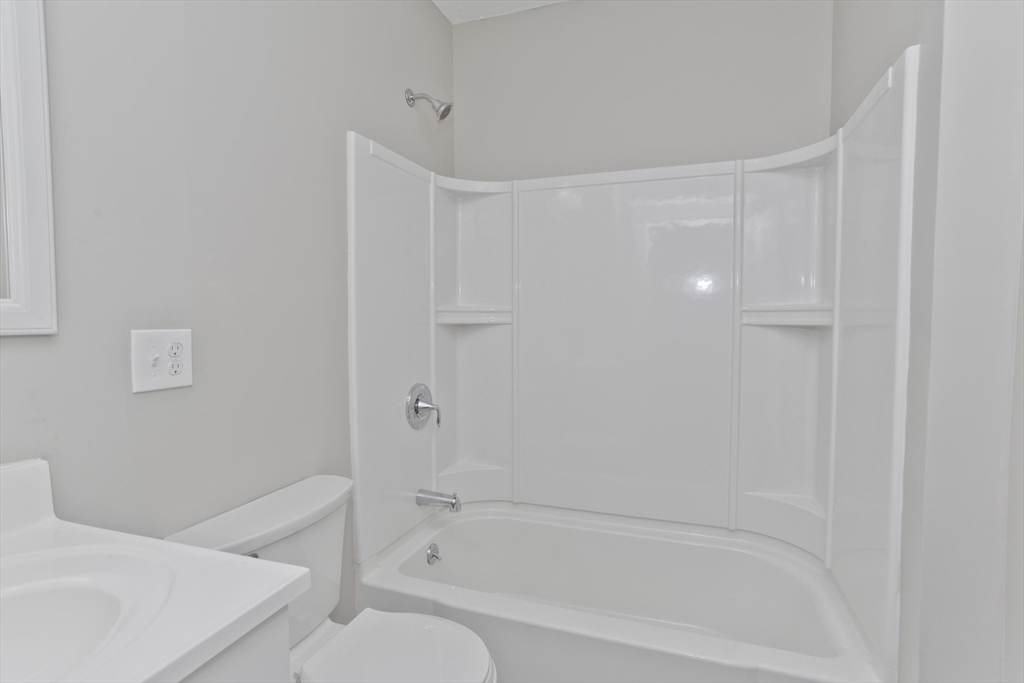 34-36 Ruskin Street Springfield, MA 01108 - Photo 16 of 27 a bathroom with a bathtub and a toilet