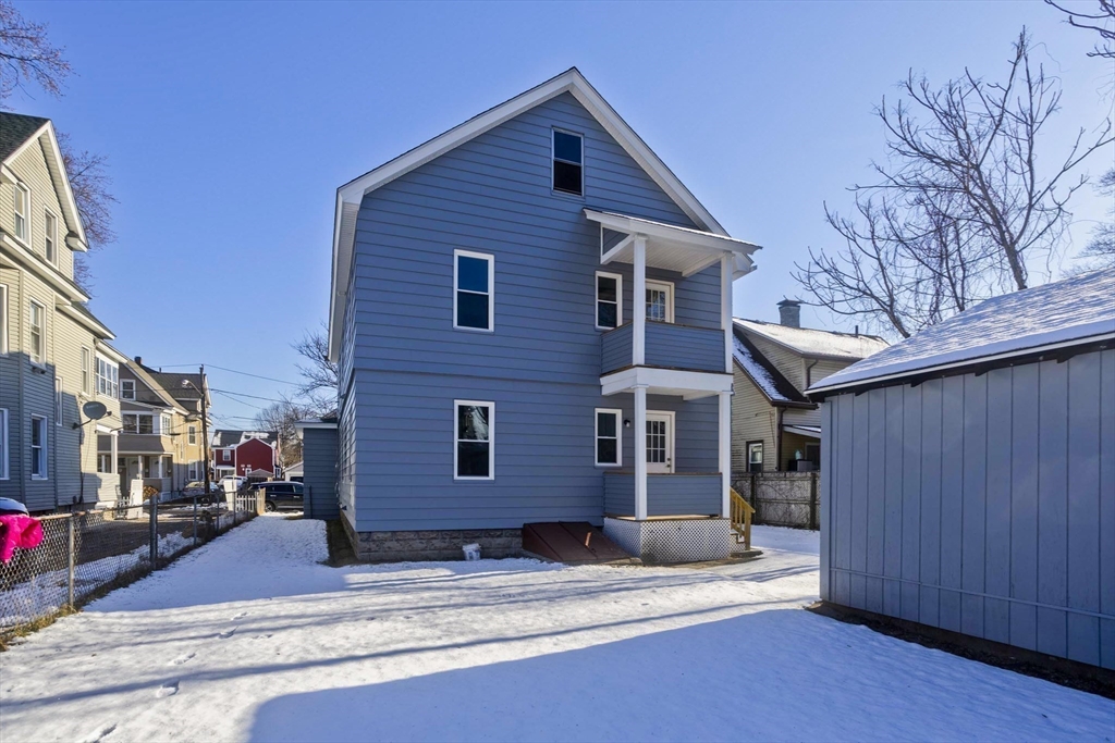 34-36 Ruskin Street Springfield, MA 01108 - Photo 23 of 27 a front view of a house with a yard
