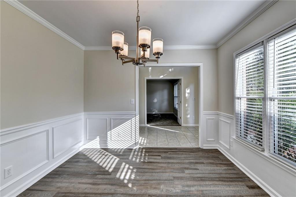 3460 Maple Terrace Drive Suwanee, GA 30024 - Photo 11 of 51 a view of a livingroom with a chandelier
