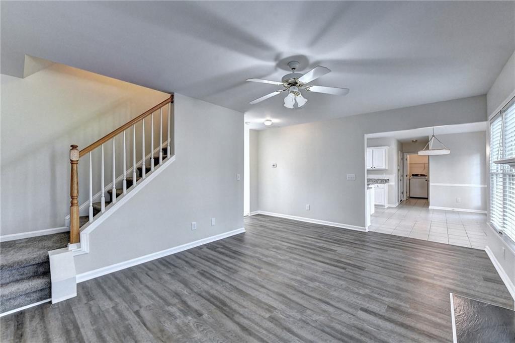 3460 Maple Terrace Drive Suwanee, GA 30024 - Photo 16 of 51 a view of an empty room with wooden floor