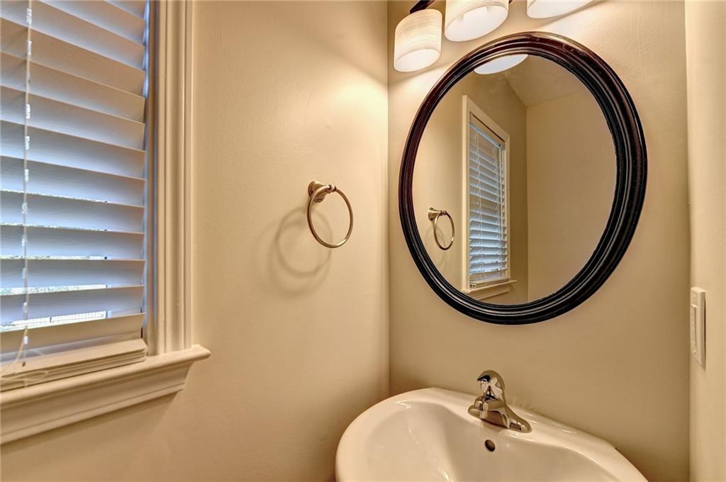 3460 Maple Terrace Drive Suwanee, GA 30024 - Photo 29 of 51 a bathroom with a sink and a mirror