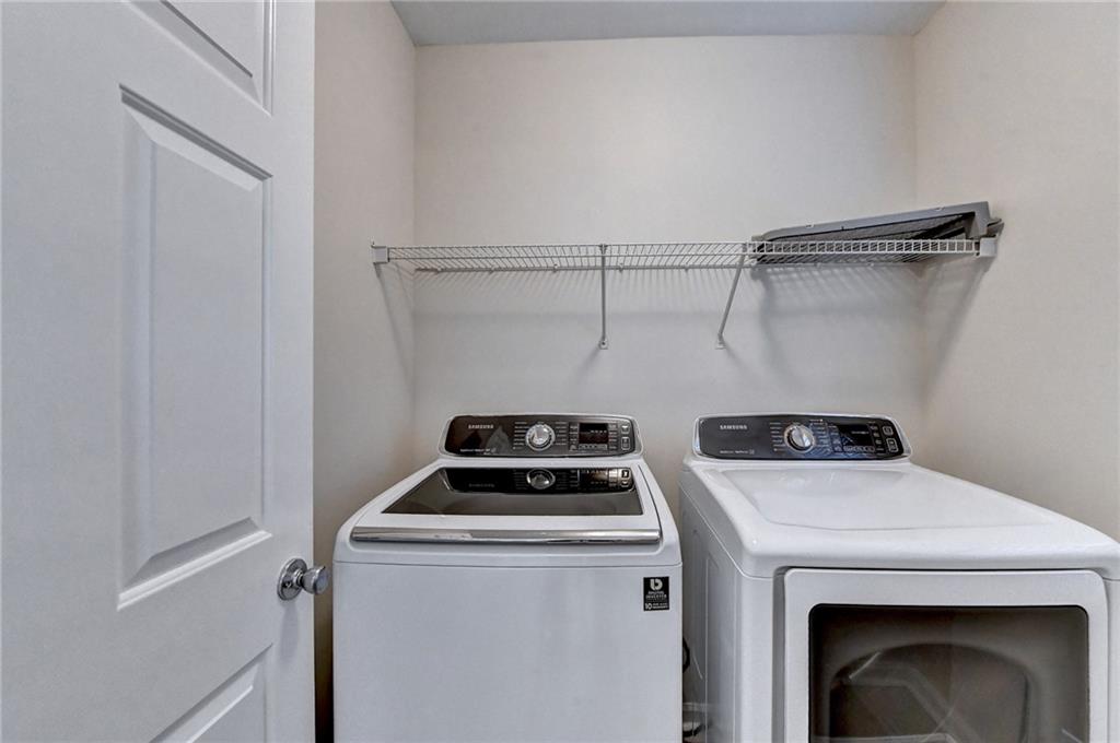 3460 Maple Terrace Drive Suwanee, GA 30024 - Photo 30 of 51 a view of storage and utility room with washer and dryer