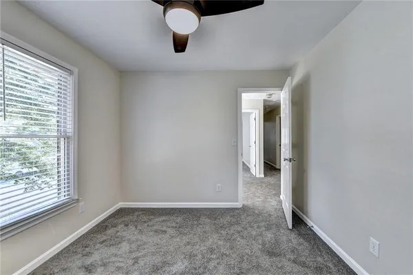a view of an empty room with a window