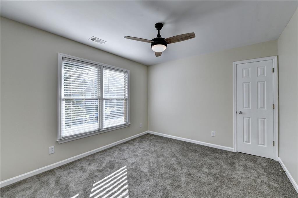 3460 Maple Terrace Drive Suwanee, GA 30024 - Photo 34 of 51 a view of an empty room with a window