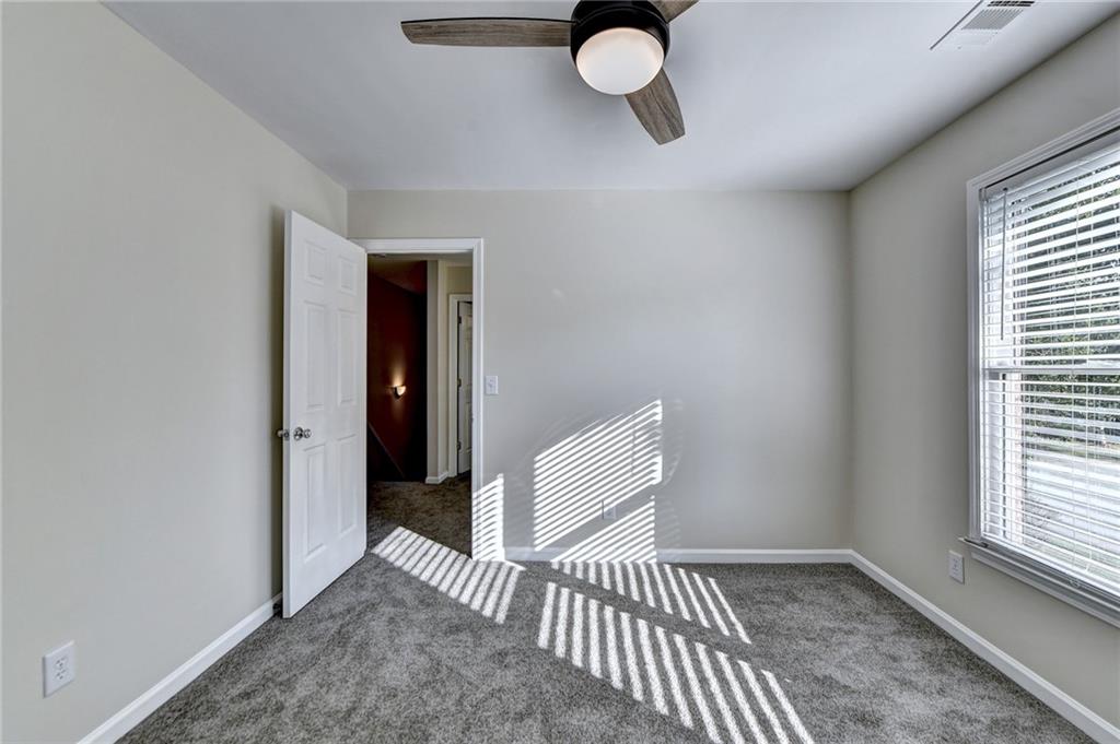 3460 Maple Terrace Drive Suwanee, GA 30024 - Photo 36 of 51 a view of a livingroom with a chair