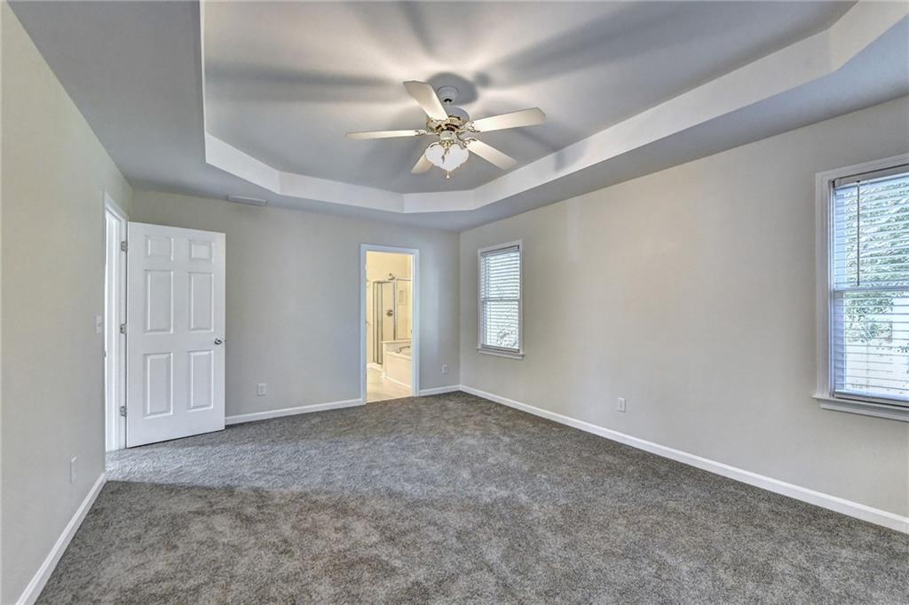 3460 Maple Terrace Drive Suwanee, GA 30024 - Photo 40 of 51 wooden floor in an empty room with a window