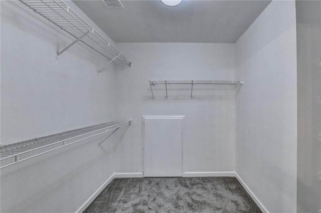 3460 Maple Terrace Drive Suwanee, GA 30024 - Photo 44 of 51 a view of a room with racks on the wall