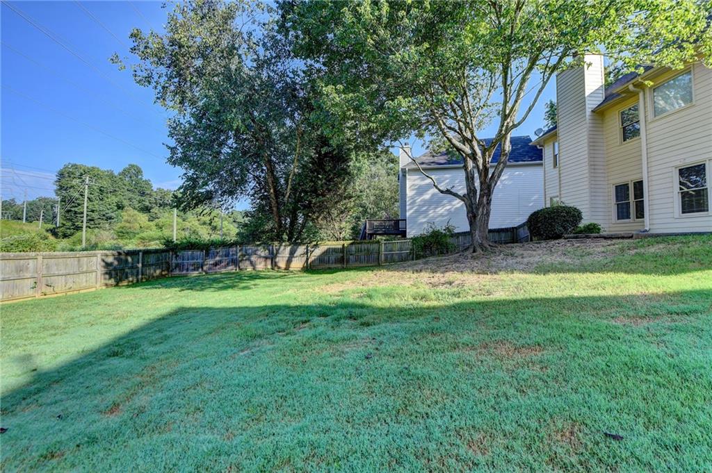3460 Maple Terrace Drive Suwanee, GA 30024 - Photo 49 of 51 a view of a backyard with a garden and plants