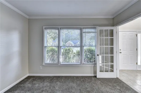 a view of an empty room with a window