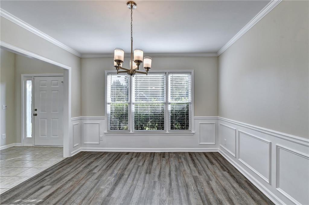 3460 Maple Terrace Drive Suwanee, GA 30024 - Photo 9 of 51 a view of empty room with wooden floor and fan
