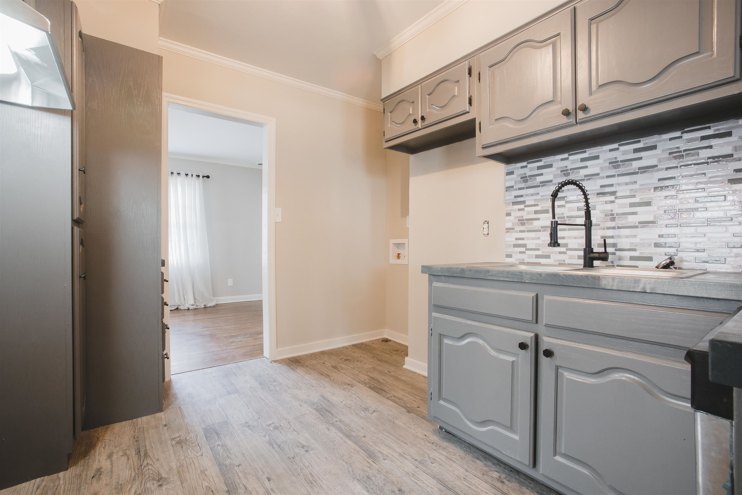 4094 Lawrence Road Memphis, TN 38122 - Photo 11 of 24 a view of cabinets with wooden floor