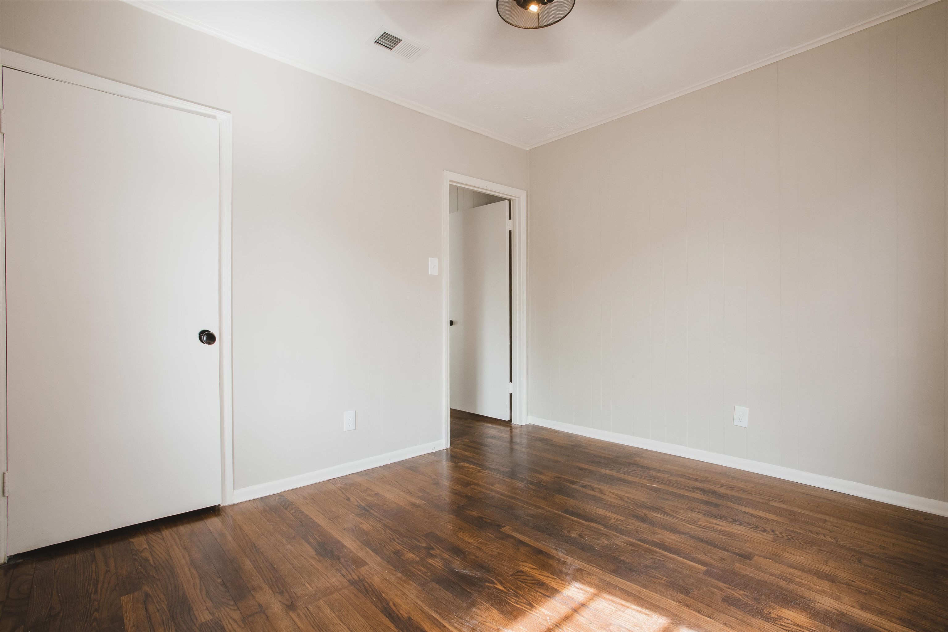 4094 Lawrence Road Memphis, TN 38122 - Photo 12 of 24 a view of an empty room with wooden floor