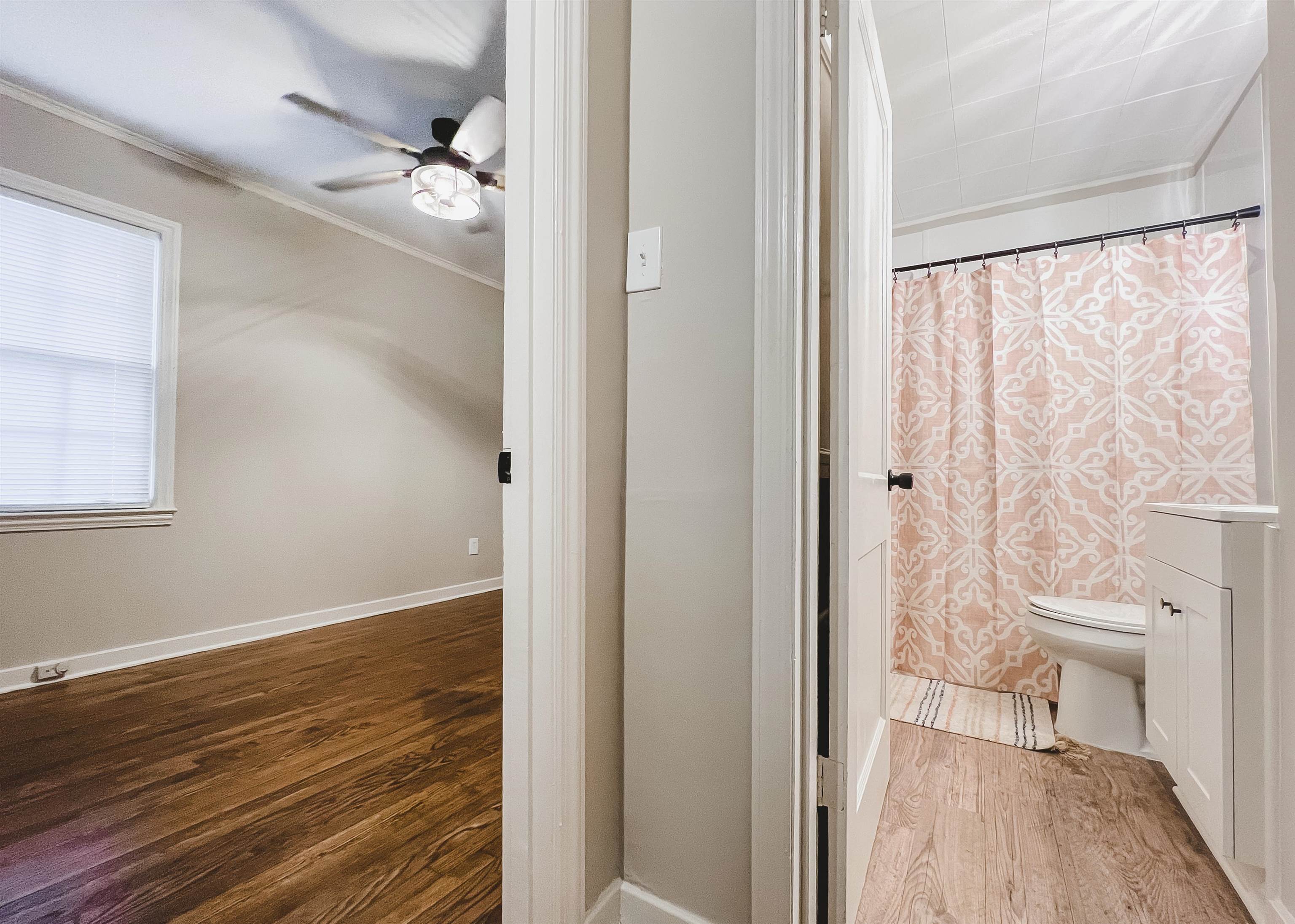 4094 Lawrence Road Memphis, TN 38122 - Photo 15 of 24 a view of small space with wooden floor and a bathroom view