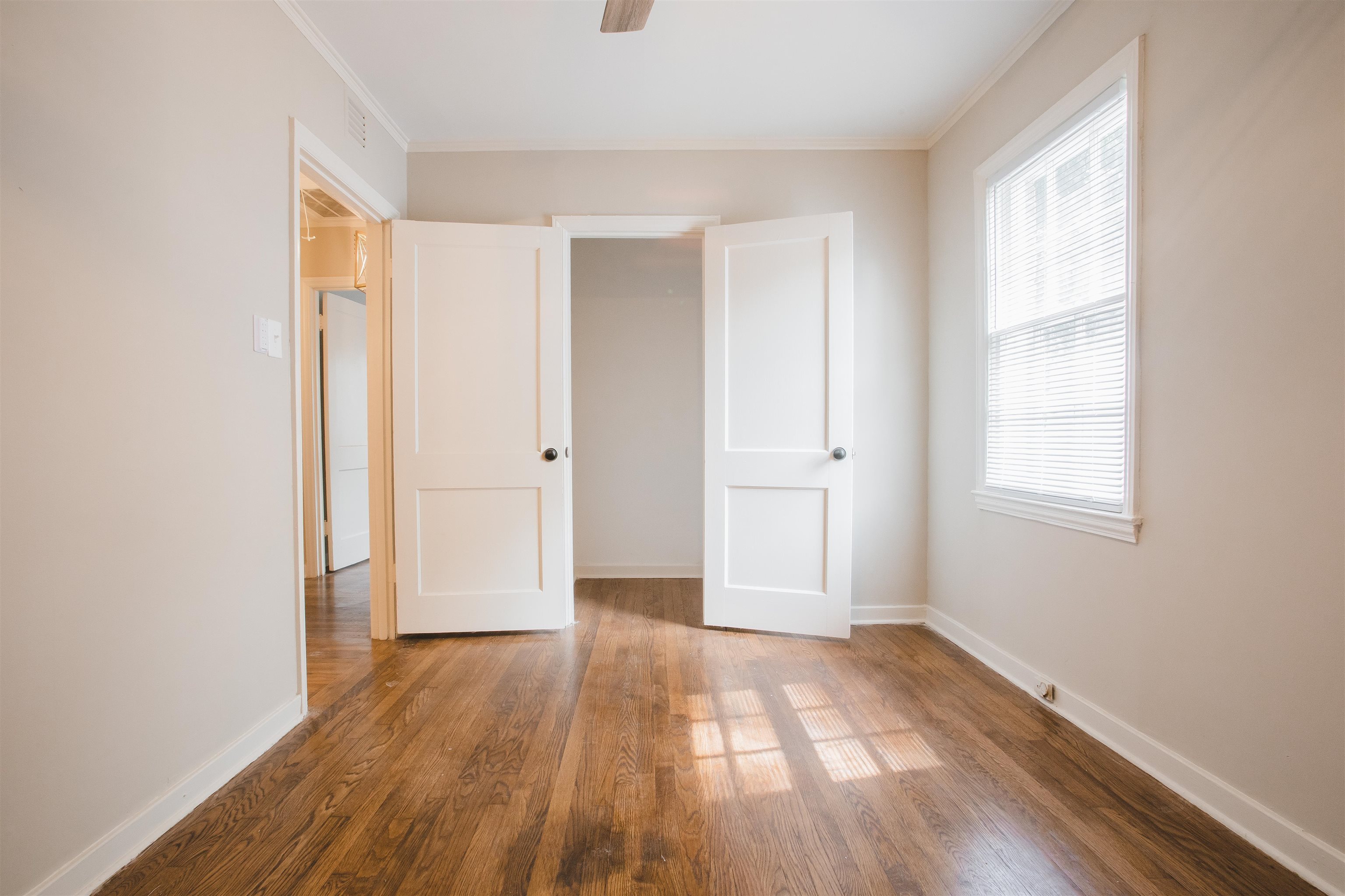 4094 Lawrence Road Memphis, TN 38122 - Photo 19 of 24 a view of an empty room with wooden floor and a window
