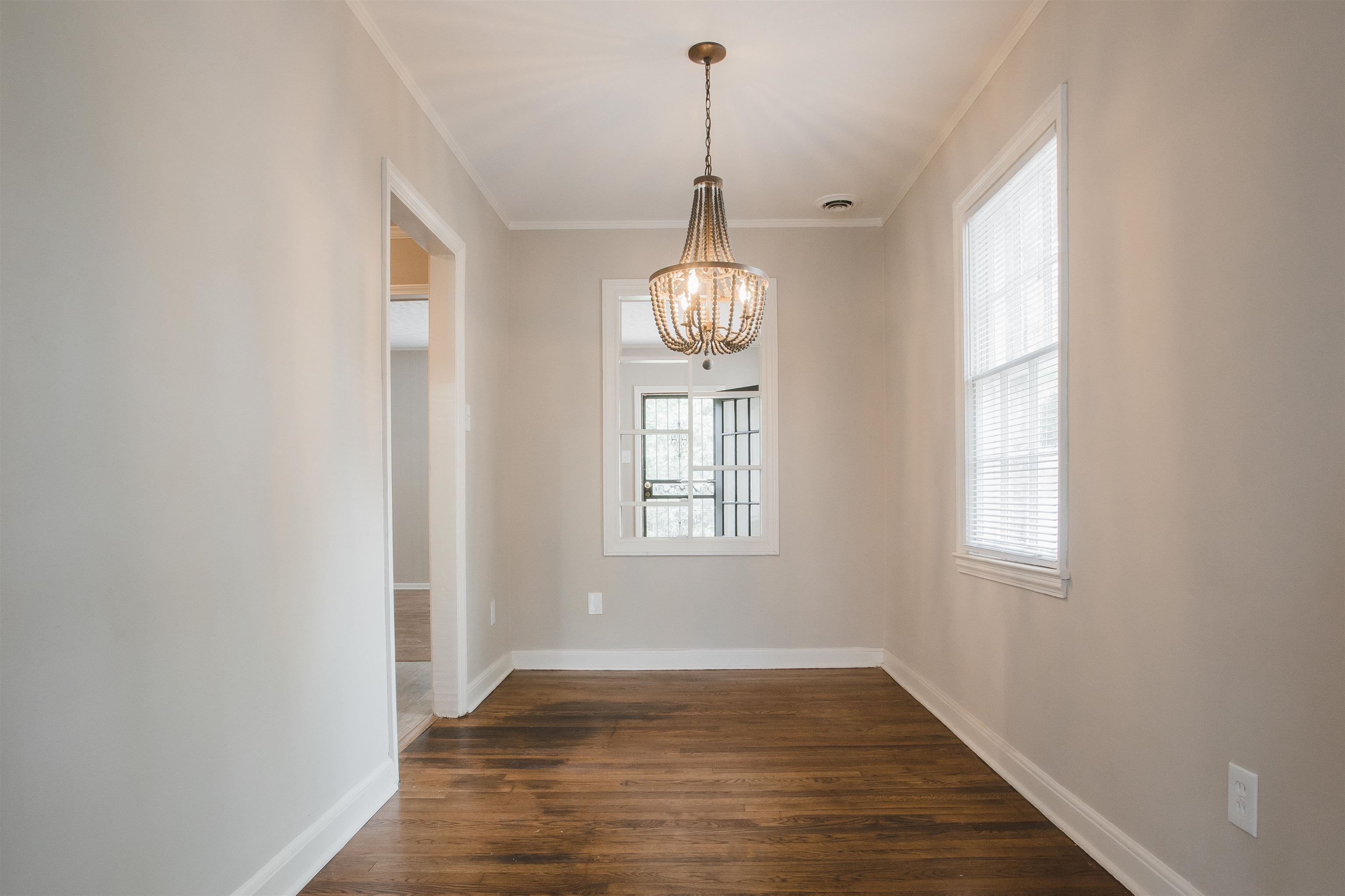 4094 Lawrence Road Memphis, TN 38122 - Photo 7 of 24 a view of empty room with wooden floor and fan