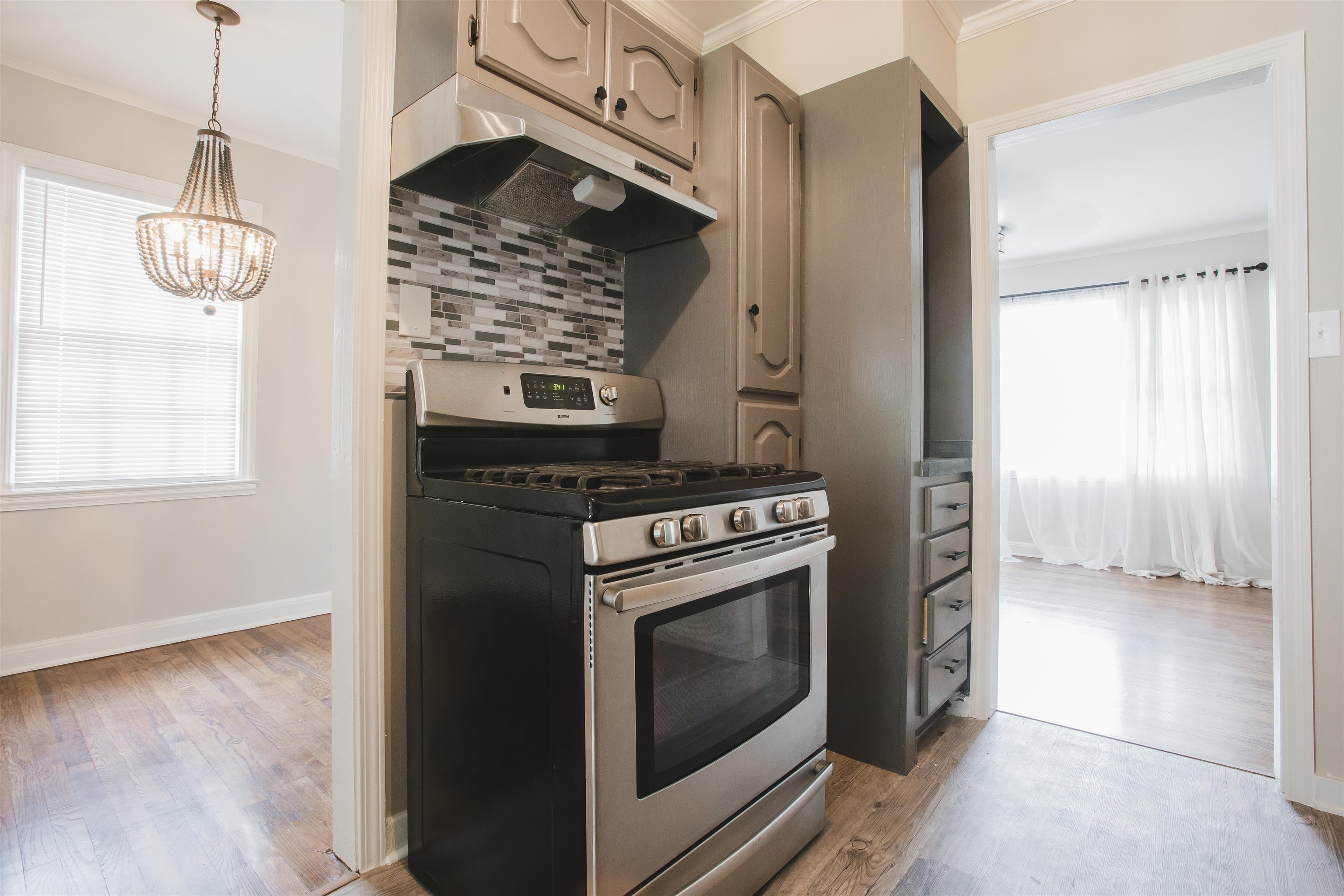 4094 Lawrence Road Memphis, TN 38122 - Photo 8 of 24 a kitchen with a stove and a microwave