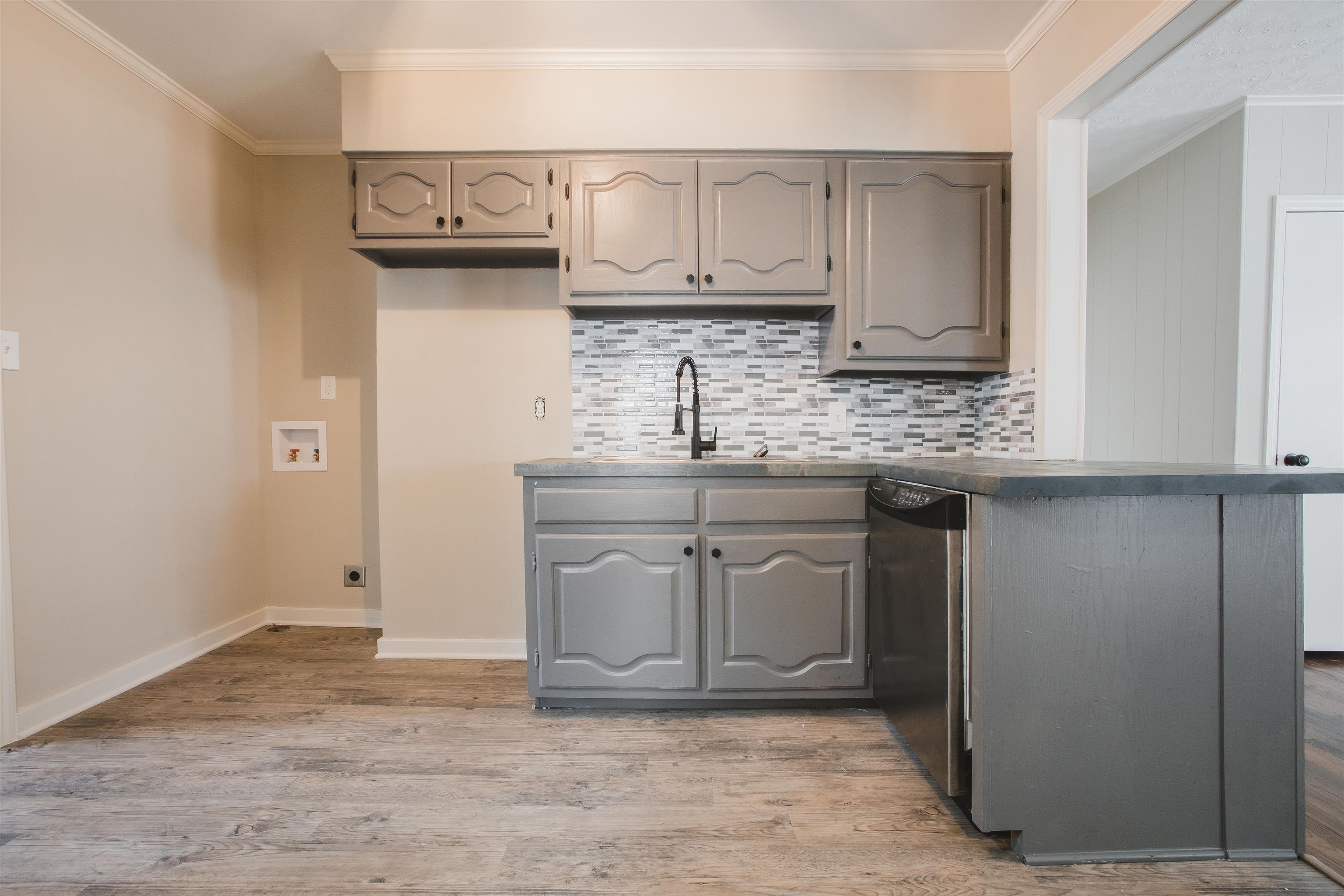 4094 Lawrence Road Memphis, TN 38122 - Photo 10 of 24 a kitchen with stainless steel appliances granite countertop a sink and cabinets