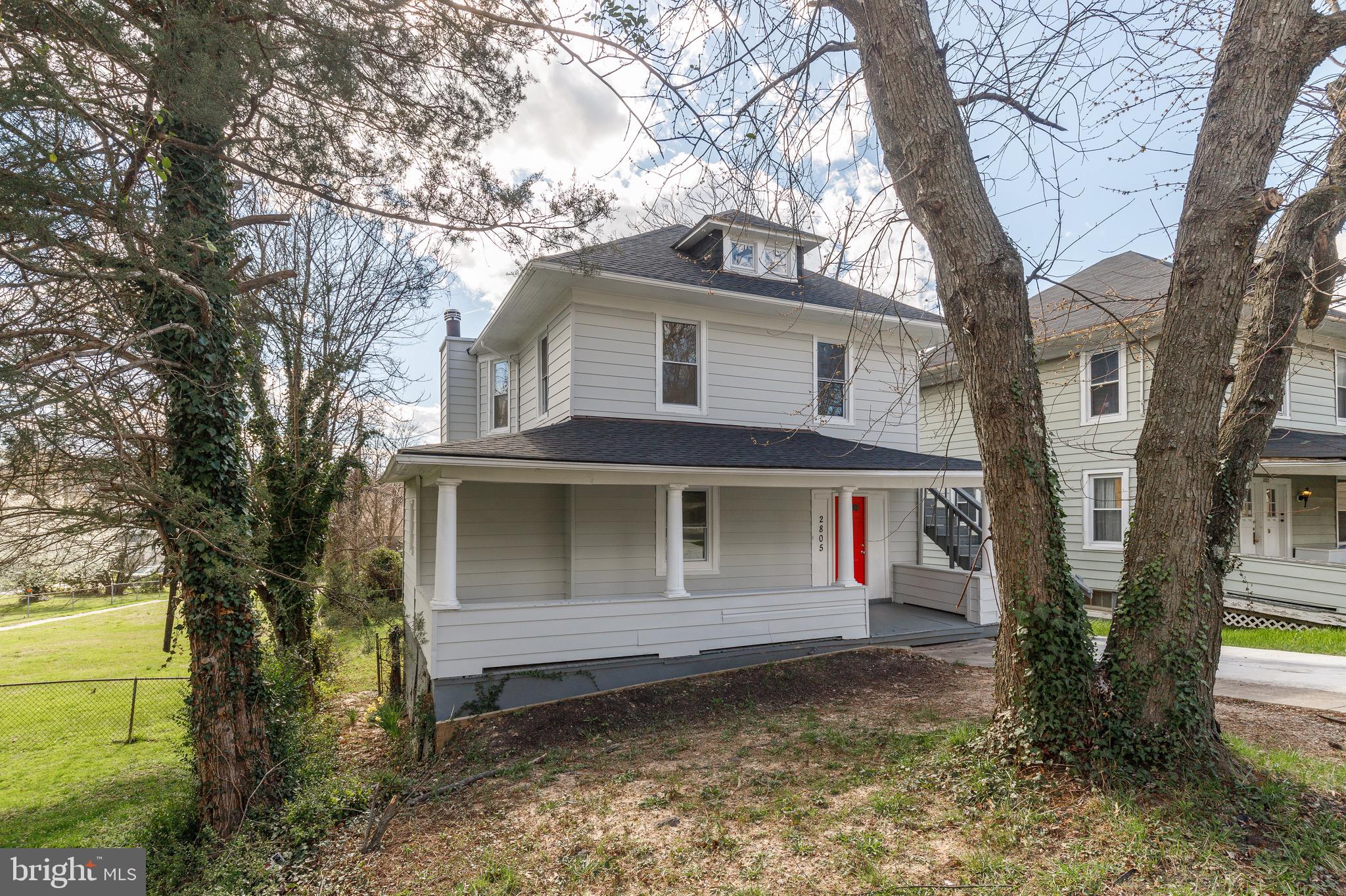 2805 Hamilton Avenue Baltimore, MD 21214 - Photo 11 of 41 a front view of a house with a yard