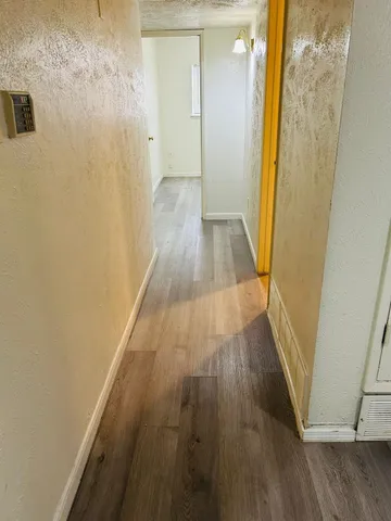 a view of a bathroom with wooden floor