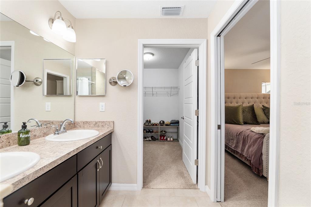 13700 Southwest 71st Lane Ocala, FL 34481 - Photo 36 of 100 a en suite bathroom with a sink double vanity and a mirror