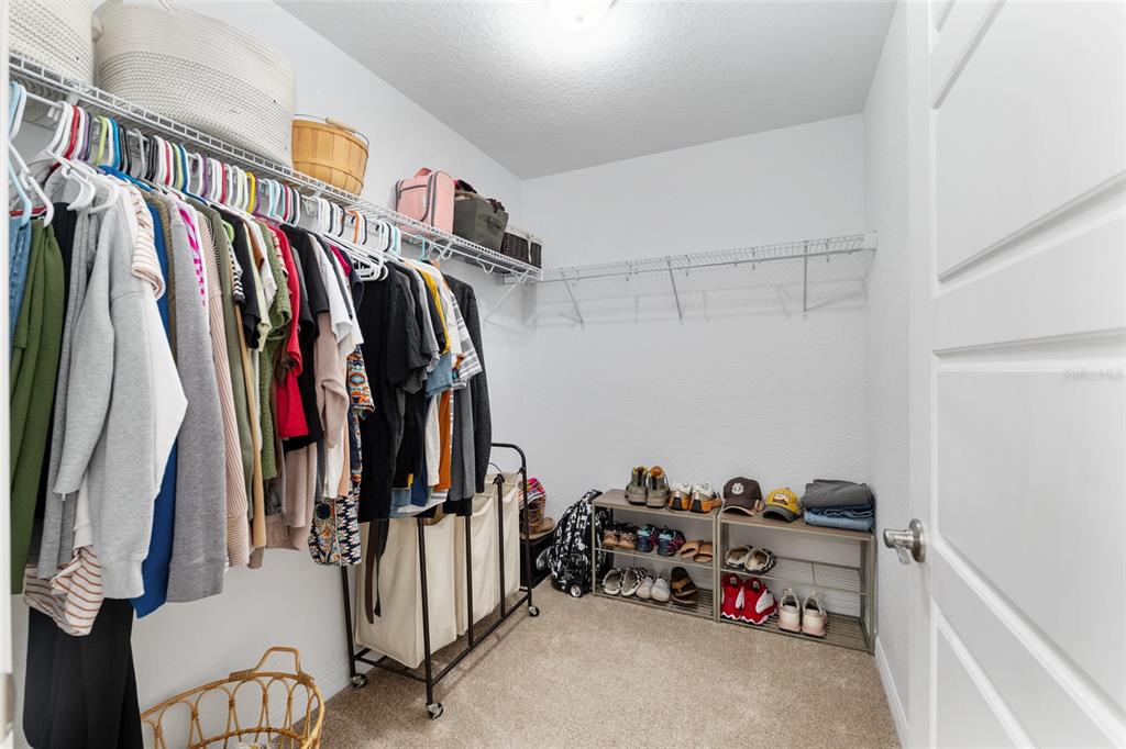 13700 Southwest 71st Lane Ocala, FL 34481 - Photo 39 of 100 a view of walk in closet with clothes and shoes
