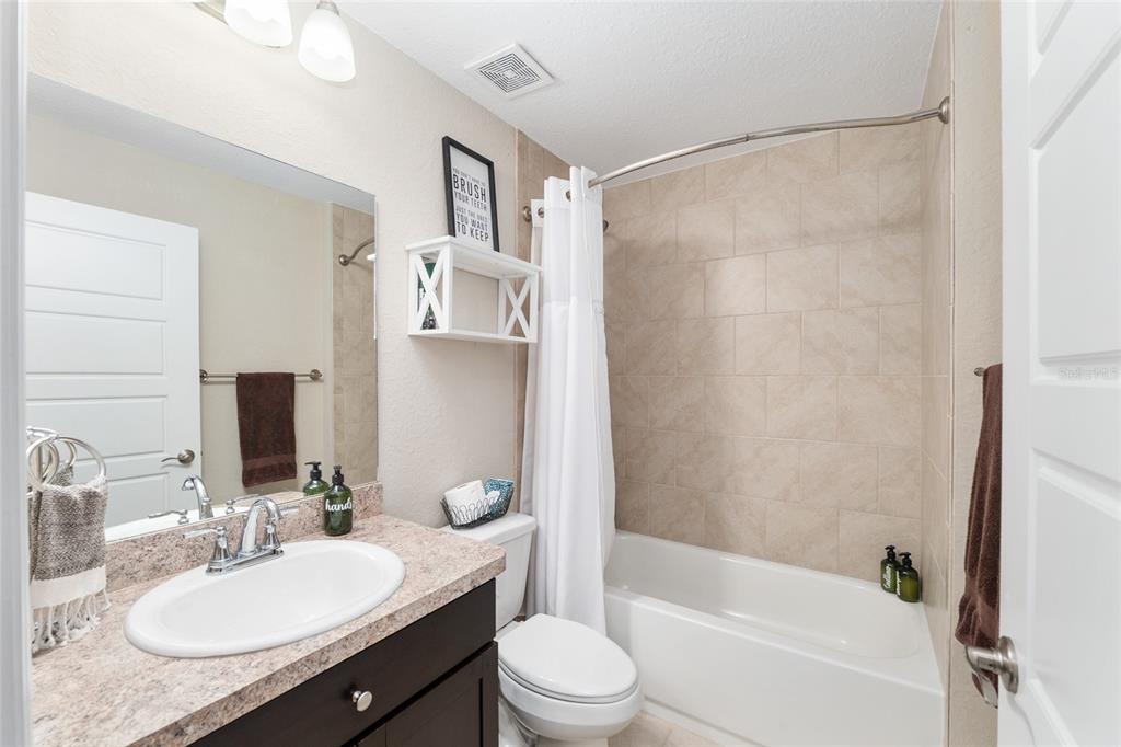 13700 Southwest 71st Lane Ocala, FL 34481 - Photo 44 of 100 a bathroom with a granite countertop sink toilet and shower