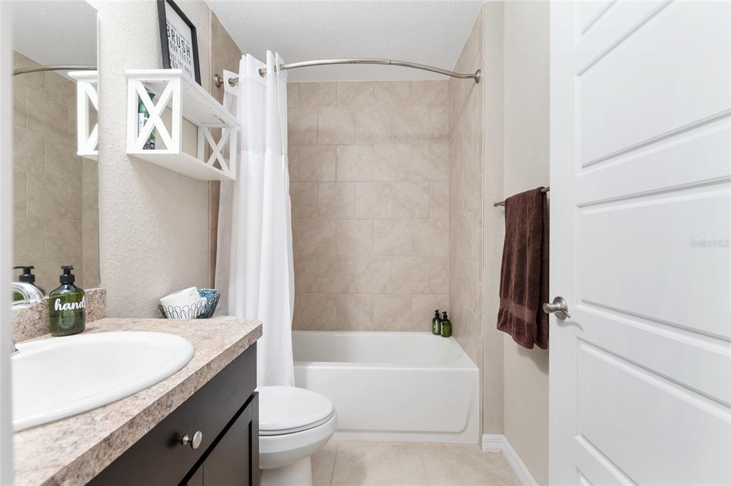13700 Southwest 71st Lane Ocala, FL 34481 - Photo 45 of 100 a bathroom with a granite countertop sink toilet and shower