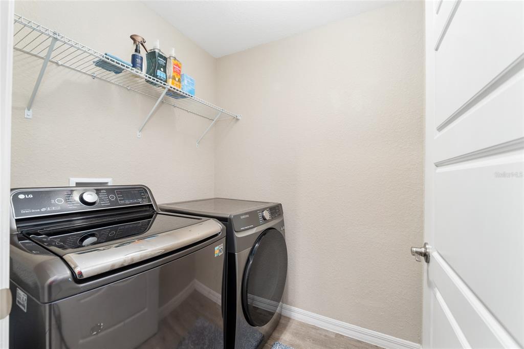 13700 Southwest 71st Lane Ocala, FL 34481 - Photo 48 of 100 a view of storage and utility room with racks on the wall
