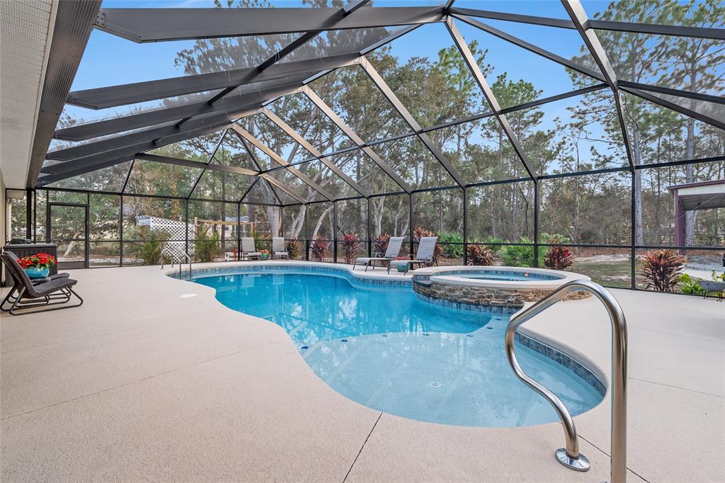 13700 Southwest 71st Lane Ocala, FL 34481 - Photo 55 of 100 a view of a swimming pool with a patio and dining area