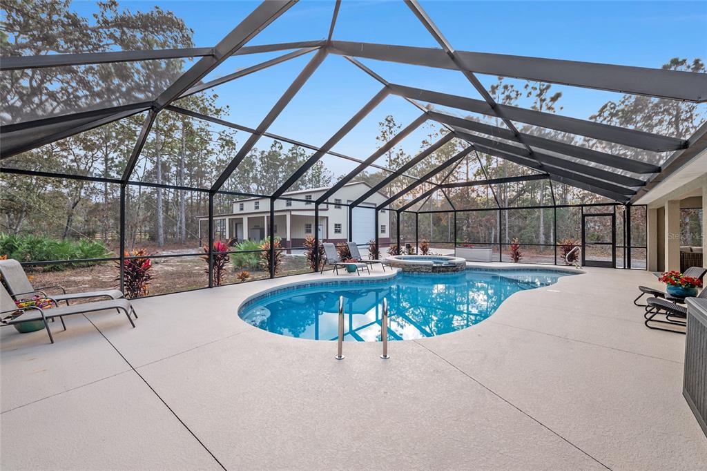 13700 Southwest 71st Lane Ocala, FL 34481 - Photo 58 of 100 a view of a swimming pool with a patio