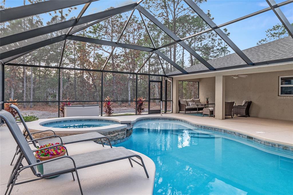 13700 Southwest 71st Lane Ocala, FL 34481 - Photo 61 of 100 a view of a swimming pool with a patio