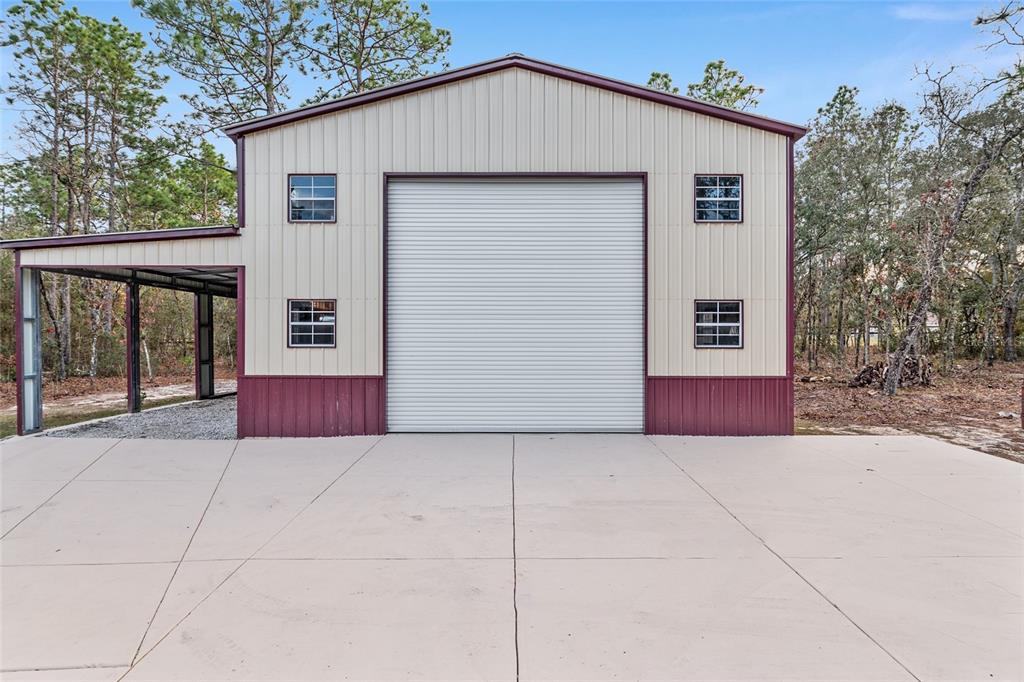 13700 Southwest 71st Lane Ocala, FL 34481 - Photo 75 of 100 a view of house with yard and a garage