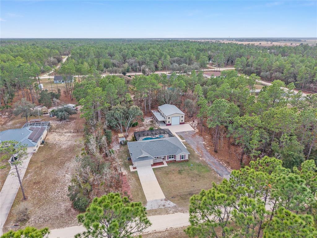 13700 Southwest 71st Lane Ocala, FL 34481 - Photo 88 of 100 an aerial view of a city with lots of residential buildings