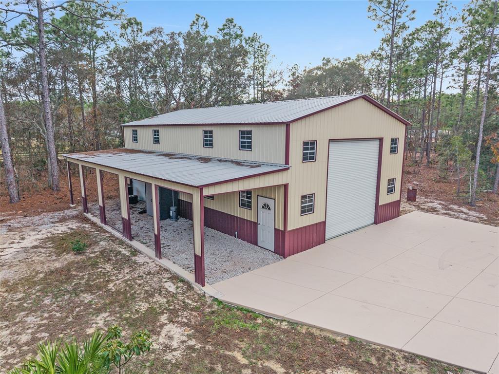 13700 Southwest 71st Lane Ocala, FL 34481 - Photo 95 of 100 a view of a house with a yard and large trees
