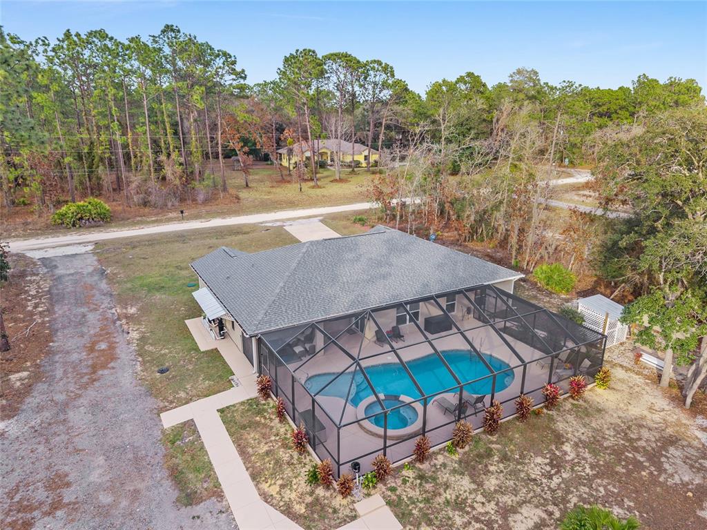 13700 Southwest 71st Lane Ocala, FL 34481 - Photo 100 of 100 a view of a house with a yard and sitting area