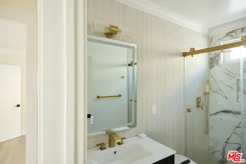 a bathroom with a sink and shower