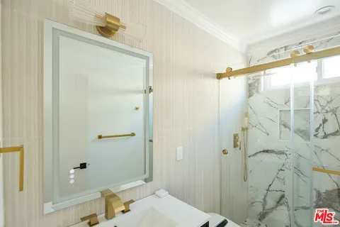a bathroom with a sink and shower