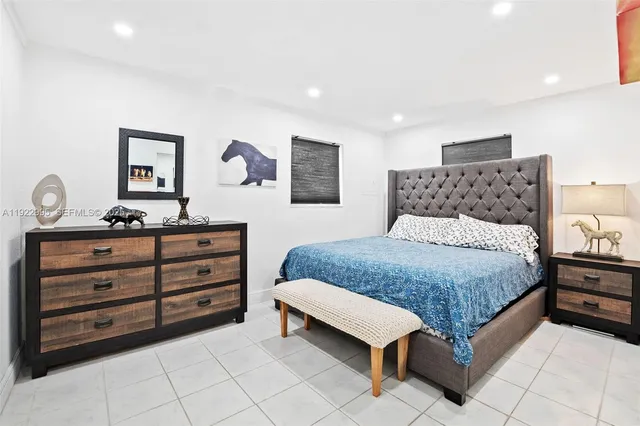 a bedroom with a bed and a dresser