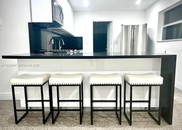 3711 Southwest 58th Avenue Davie, FL 33314 - Photo 4 of 40 a kitchen with a table and chairs