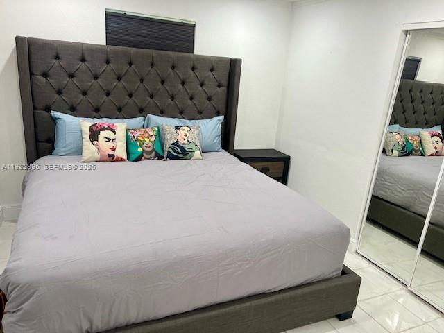 3711 Southwest 58th Avenue Davie, FL 33314 - Photo 8 of 40 a bedroom with a bed and dresser