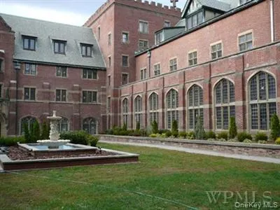 a view of a building with a yard