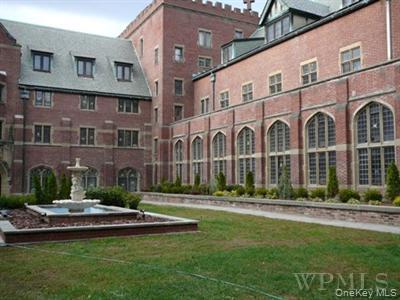 207 Chateau Rive, Unit 207 Peekskill, NY 10566 - Photo 1 of 16 a view of a building with a yard
