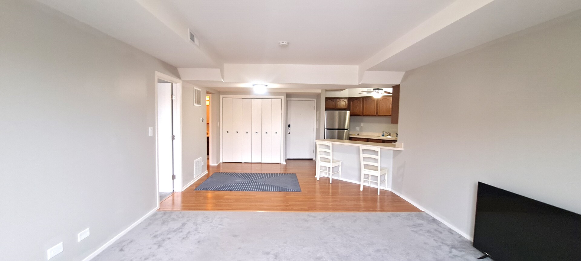 6337 Roosevelt Road, Unit 202 Berwyn, IL 60402 - Photo 2 of 9 wooden floor in an empty room with a window