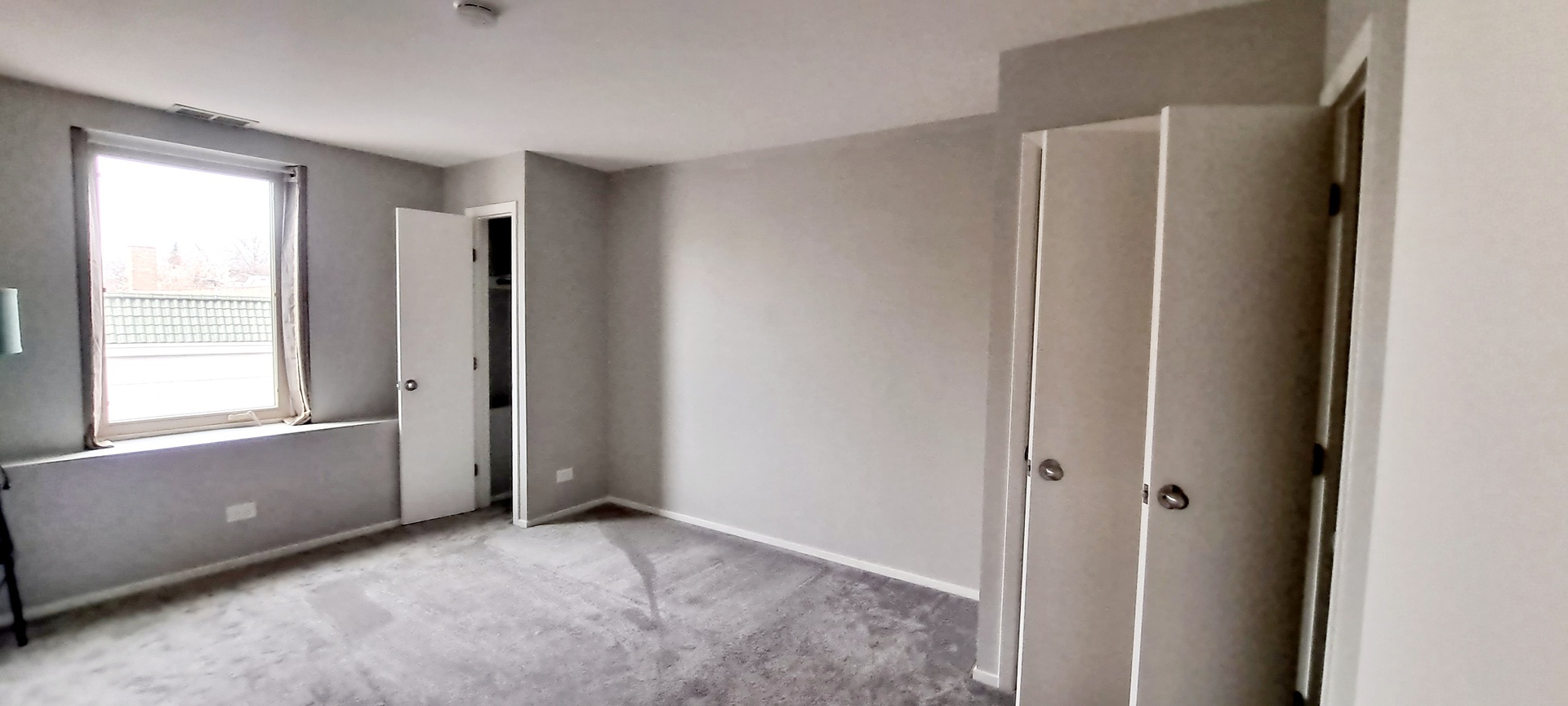 6337 Roosevelt Road, Unit 202 Berwyn, IL 60402 - Photo 8 of 9 a view of an empty room with a window