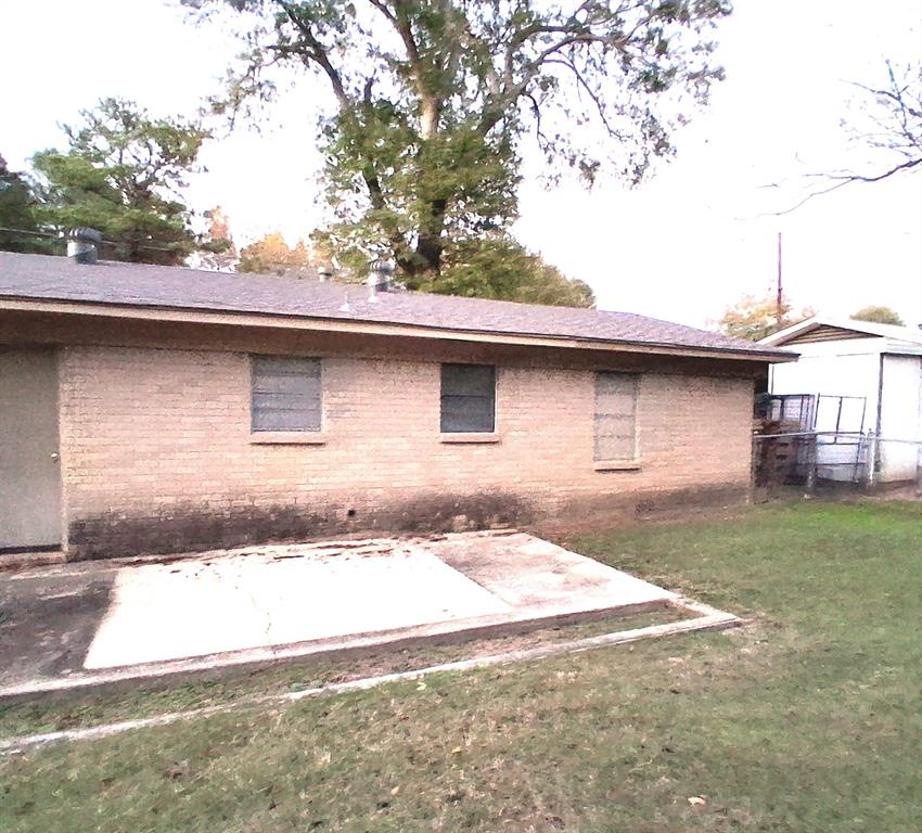 135 Akins Road Texarkana, TX 75501 - Photo 12 of 12 a front view of a house with garden