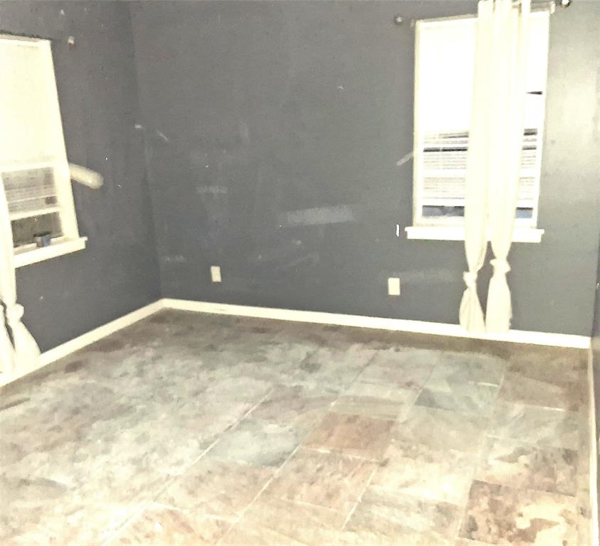 135 Akins Road Texarkana, TX 75501 - Photo 8 of 12 a view of a window in an empty room